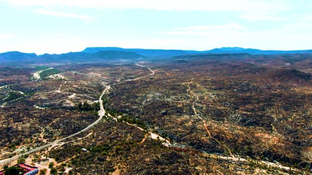 CATAVINA BC MEXICO-2022: Vehicles Traverse Winding Roads Through Hilly Landscape