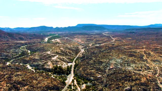 CATAVINA BC MEXICO-2022: Winding Road Through Arid Hills with Moving Vehicle