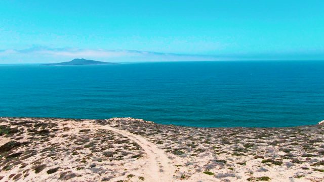 SAN QUINTIN BC MEXICO-2022: Coastal Hillside Path with Ocean View