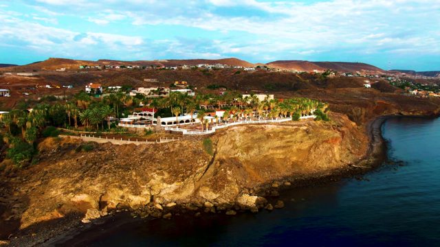 SANTA ROSALIA BCS MEXICO-2022: Waves Lapping Rocky Shore at Coastal Cliff