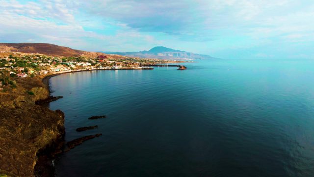 SANTA ROSALIA BCS MEXICO-2022: Gentle Ocean Waves Lapping at Rocky Coastline