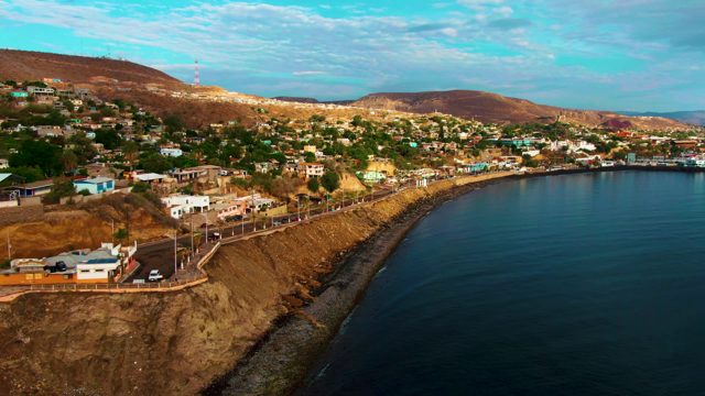 SANTA ROSALIA BCS MEXICO-2022: Car Driving Along Cliffside Coastal Road