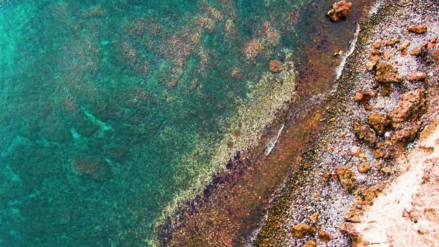 SANTA ROSALIA BCS MEXICO-2022: Gentle Waves Lapping Rocky Shoreline From Above