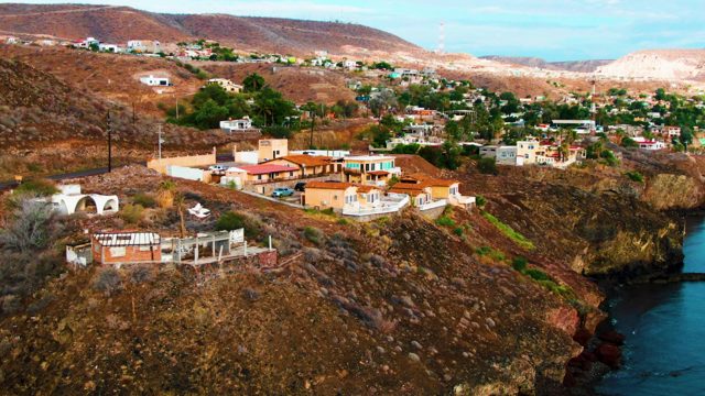 SANTA ROSALIA BCS MEXICO-2022: Hillside Residential Area with Departing Car