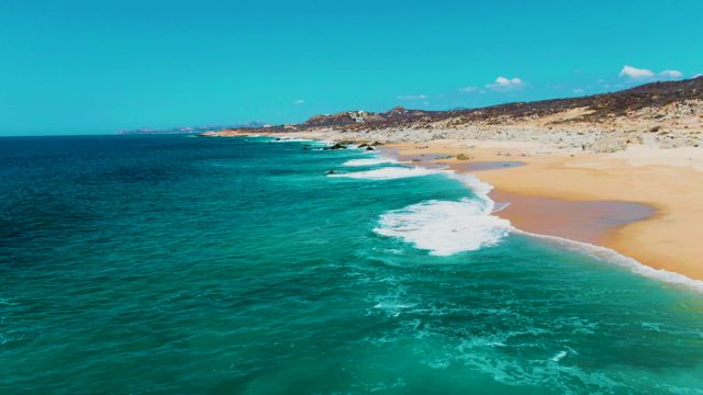 PUNTA BUZZARDS EAST CAPE BCS MEXICO-2022: Waves Crashing on Sandy Shore From Aerial View