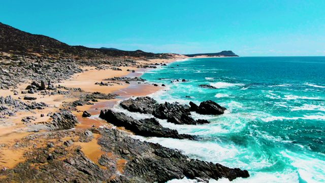 PUNTA BUZZARDS EAST CAPE BCS MEXICO-2022: Waves Crashing on Rocky Beach Shoreline
