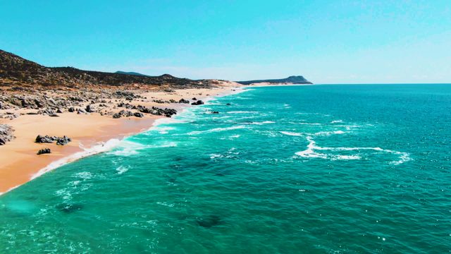 PUNTA BUZZARDS EAST CAPE BCS MEXICO-2022: Waves Crashing on Sandy Beach Coastline