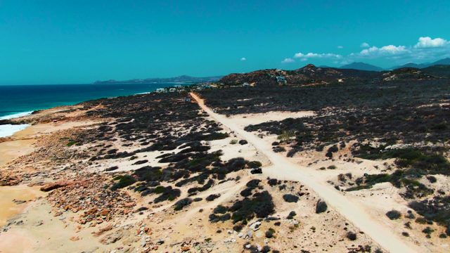PUNTA BUZZARDS EAST CAPE BCS MEXICO-2022: Car Traveling on Coastal Dirt Road