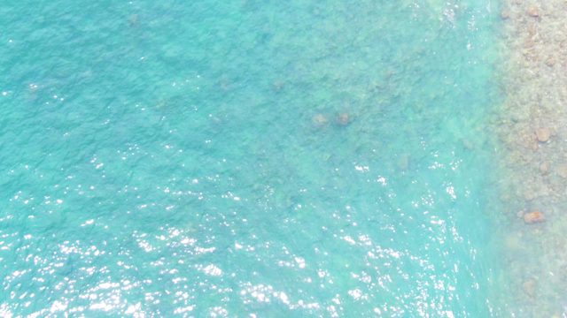 PUNTA BUZZARDS EAST CAPE BCS MEXICO-2022: Turquoise Ocean Water Flowing Over Rocky Shore