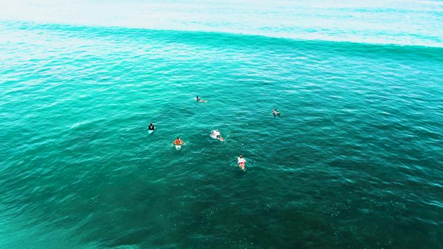 PUNTA BUZZARDS EAST CAPE BCS MEXICO-2022: Surfers Waiting for Waves in Turquoise Ocean
