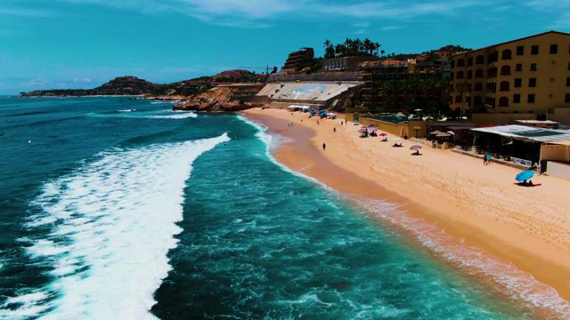PUNTA BUZZARDS EAST CAPE BCS MEXICO-2022: Beachgoers and Breaking Waves at Shore