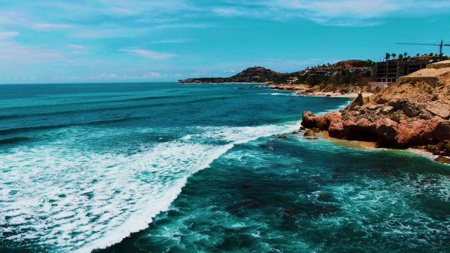 PUNTA BUZZARDS EAST CAPE BCS MEXICO-2022: Ocean Wave Breaking Against Rocky Coastline