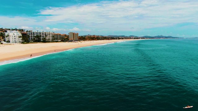 PUNTA BUZZARDS EAST CAPE BCS MEXICO-2022: Beach and Ocean with People Departing the Water
