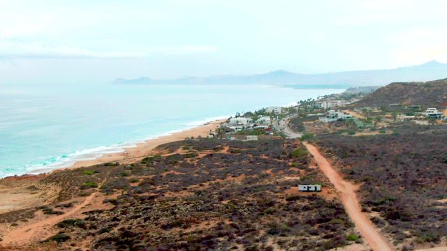 PUNTA BUZZARDS EAST CAPE BCS MEXICO-2022: Vehicle Traveling on Coastal Dirt Road near Beach