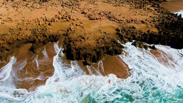 PUNTA BUZZARDS EAST CAPE BCS MEXICO-2022: Waves Crashing on Rocky Coastal Shore