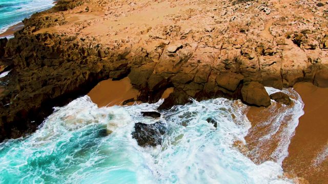 PUNTA BUZZARDS EAST CAPE BCS MEXICO-2022: Waves Crashing on Rocky Shore with Sandy Beach