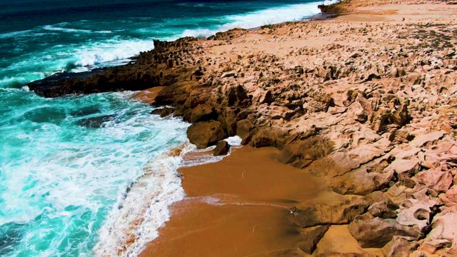 PUNTA BUZZARDS EAST CAPE BCS MEXICO-2022: Waves Crashing on Rocky Coastal Shore