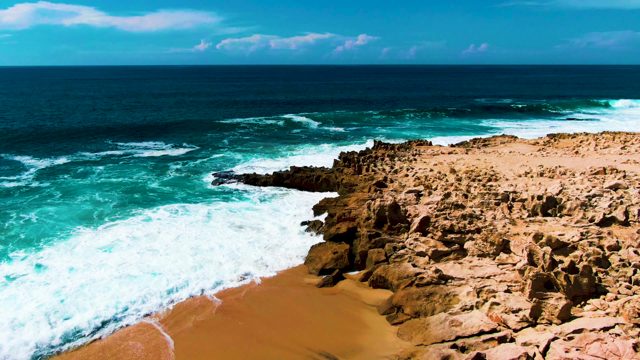PUNTA BUZZARDS EAST CAPE BCS MEXICO-2022: Waves Crashing and Receding on Rocky Shore