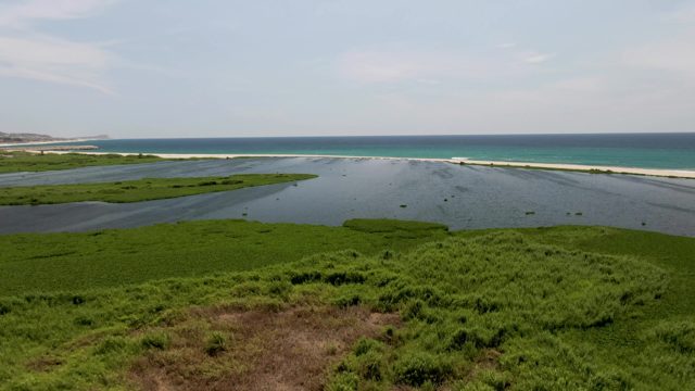 SAN JOSE DEL CABO BCS MEXICO-2022: Coastal Lagoon with Moving Debris and Calm Ocean