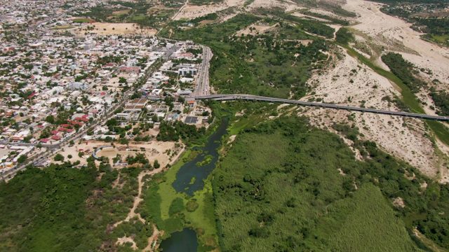 SAN JOSE DEL CABO BCS MEXICO-2022: Vehicles Moving on Bridge and Road Near City