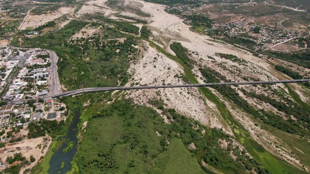 SAN JOSE DEL CABO BCS MEXICO-2022: Bridge over River with Urban and Natural Landscape