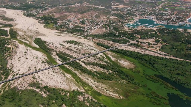 SAN JOSE DEL CABO BCS MEXICO-2022: River and Bridge with Coastal Beach