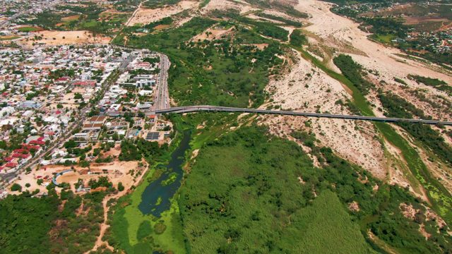 SAN JOSE DEL CABO BCS MEXICO-2022: Traffic Moving on Highway Bridge and Urban Road