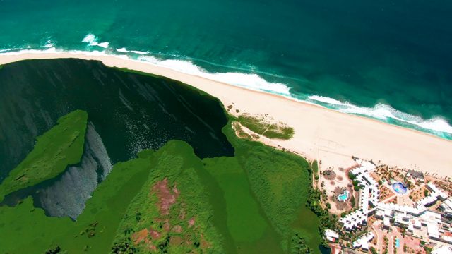 SAN JOSE DEL CABO BCS MEXICO-2022: Cliffside Beach with Resort and Ocean Waves
