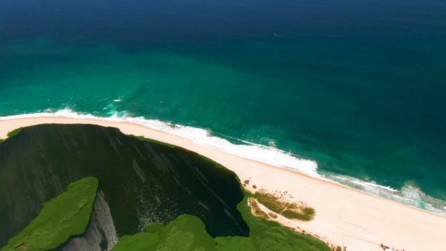 SAN JOSE DEL CABO BCS MEXICO-2022: Cliff-Top View of Sandy Beach and Turquoise Ocean