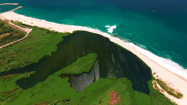 SAN JOSE DEL CABO BCS MEXICO-2022: Coastal Cliff Overlooking Sandy Beach and Turquoise Sea