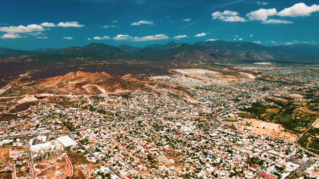 SAN JOSE DEL CABO BCS MEXICO-2022: City and Distant Mountains Aerial Pan