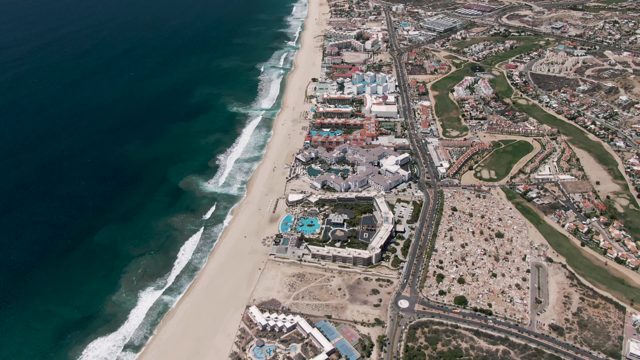 SAN JOSE DEL CABO BCS MEXICO-2022: Coastal Highway, Sandy Beach, and Ocean Waves in Motion