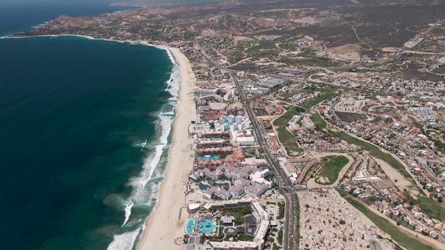 SAN JOSE DEL CABO BCS MEXICO-2022: Sandy Beach and Highway with Traffic Flow