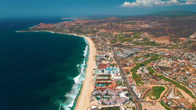 SAN JOSE DEL CABO BCS MEXICO-2022: Coastal Road, Beach, and Ocean with Moving Vehicles and Waves