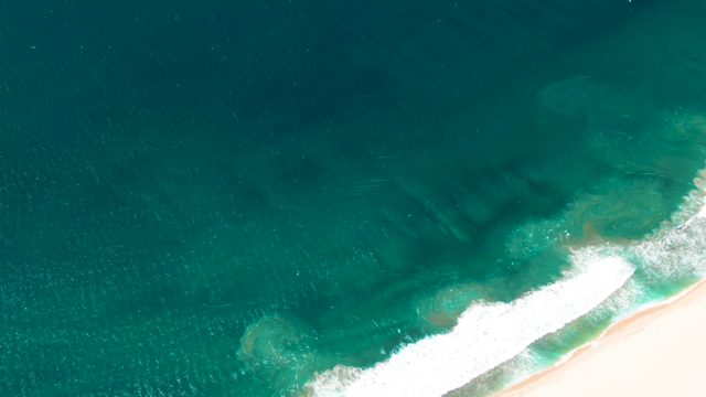 SAN JOSE DEL CABO BCS MEXICO-2022: Ocean Waves Rolling Onto Sandy Shore From Above