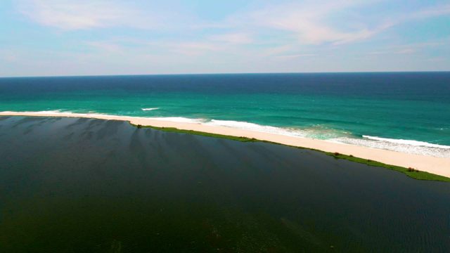SAN JOSE DEL CABO BCS MEXICO-2022: Waves Rolling Onto Sandy Shore From Above