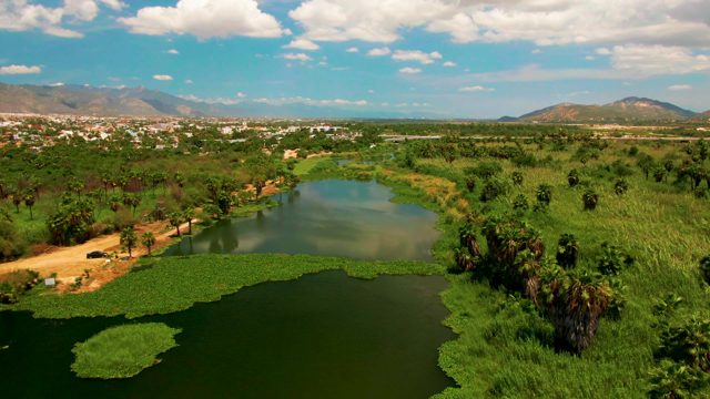 SAN JOSE DEL CABO BCS MEXICO-2022: Vehicle Moving Along Riverbank Path