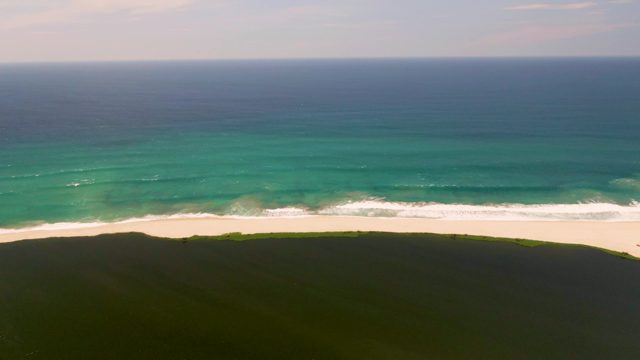 Waves Approaching White Sand Beach From Above