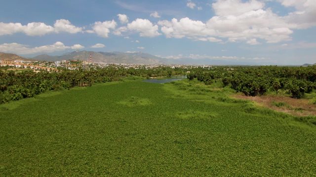 Shifting Clouds Over Lush Green Field