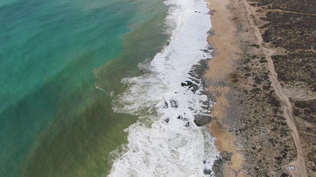 PUNTA GORDO EAST CAPE BCS MEXICO-2022: Ocean Waves Breaking on Sandy Rocky Shore