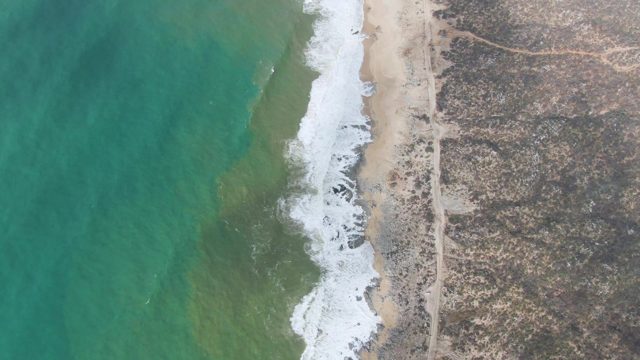 PUNTA GORDO EAST CAPE BCS MEXICO-2022: Waves Crashing on Sandy Beach From Above