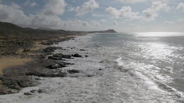 PUNTA GORDO EAST CAPE BCS MEXICO-2022: Waves Rolling Over Rocky Shore and Sandy Beach