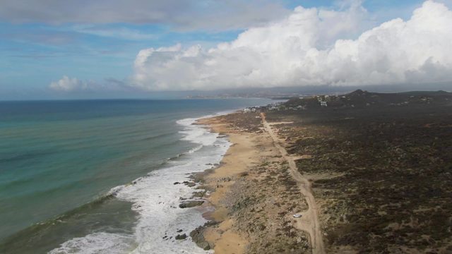PUNTA GORDO EAST CAPE BCS MEXICO-2022: Vehicle Driving Along Coastal Dirt Road by Ocean