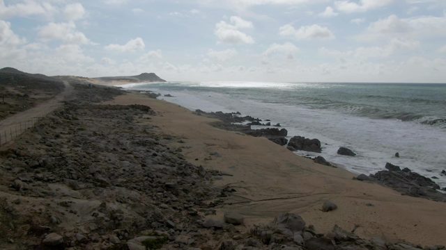PUNTA GORDO EAST CAPE BCS MEXICO-2022: Waves Crashing on Rocky Beach Shoreline
