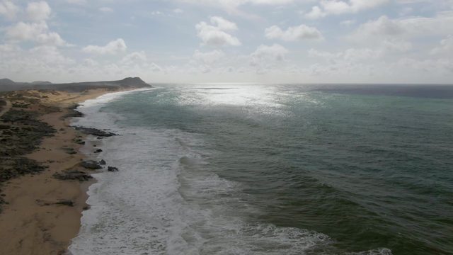 PUNTA GORDO EAST CAPE BCS MEXICO-2022: Ocean Waves Breaking on Sandy Beach Coastline