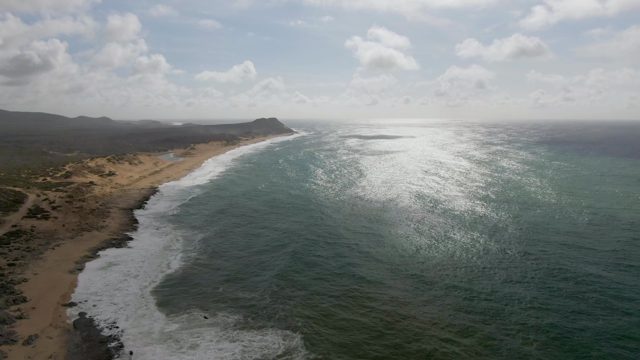 PUNTA GORDO EAST CAPE BCS MEXICO-2022: Vehicle Traveling Along Sandy Shoreline