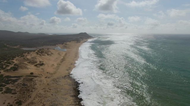 PUNTA GORDO EAST CAPE BCS MEXICO-2022: Waves Crashing Onto Sandy Beach with Dunes