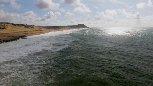 PUNTA GORDO EAST CAPE BCS MEXICO-2022: Waves Crashing Onto Sandy Beach Shoreline