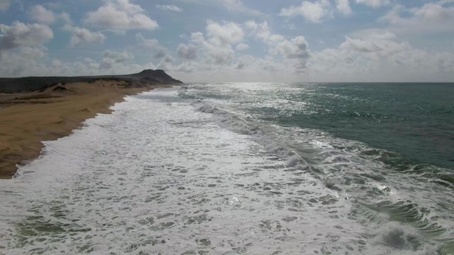 PUNTA GORDO EAST CAPE BCS MEXICO-2022: Ocean Waves Rolling Onto Sandy Beach