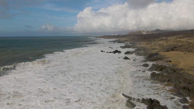 PUNTA GORDO EAST CAPE BCS MEXICO-2022: Waves Crashing on Rocky Beach Shoreline